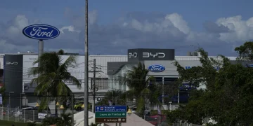 Signs are displayed for dealerships for BYD and Ford in Camacari, Bahia state, Brazil, Friday, March 7, 2025